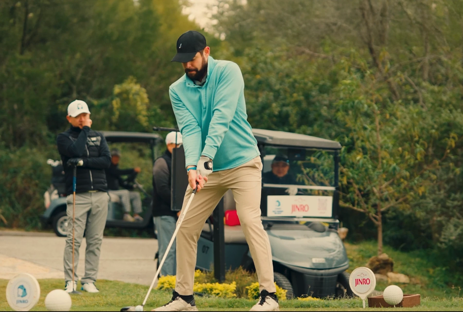Golfer preparing to swing at a JINRO-sponsored event