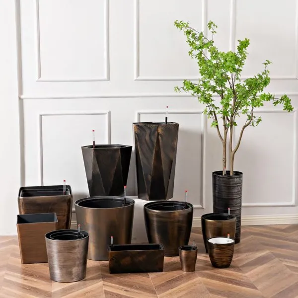 a collection of self-watering pots