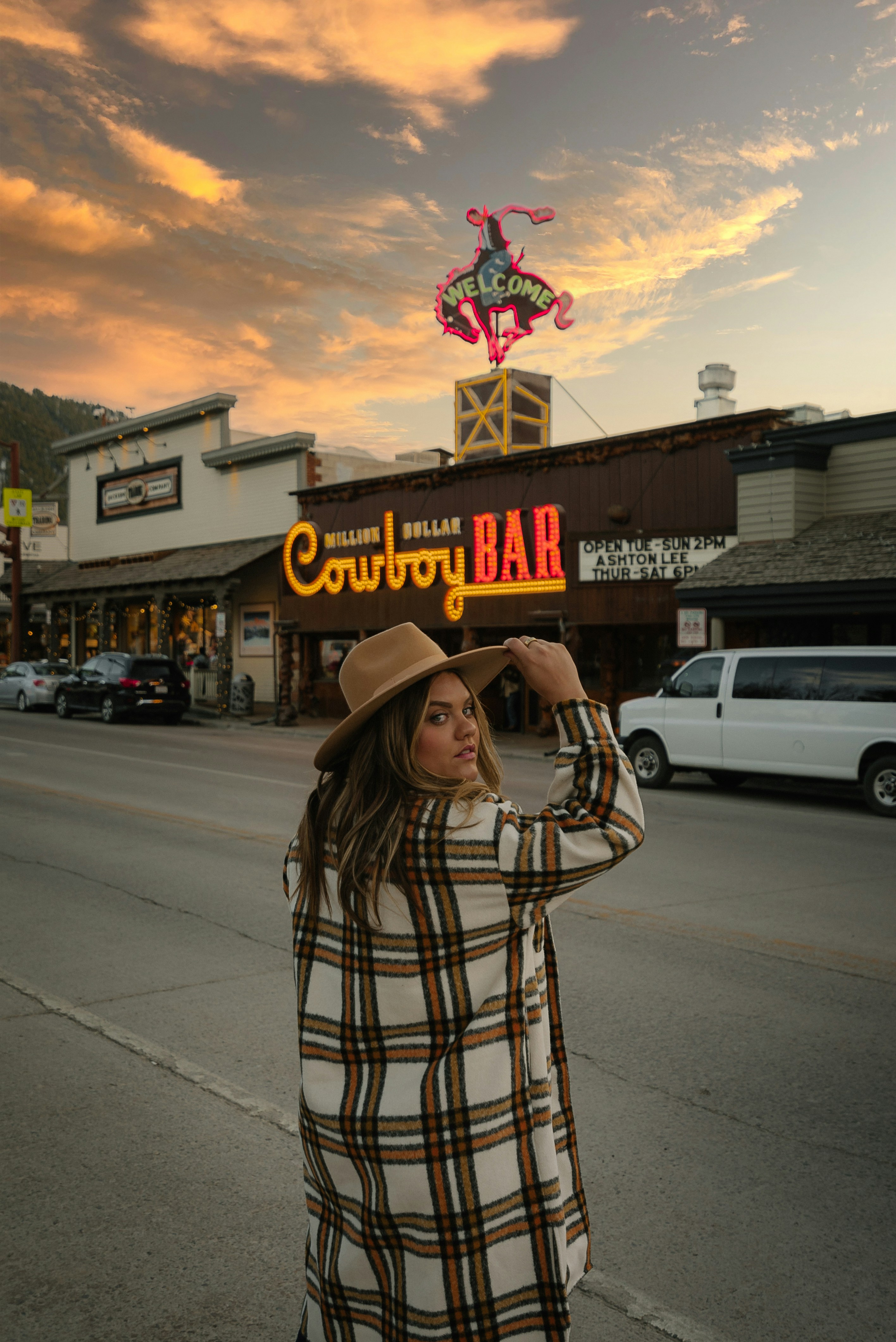 Stylish girl in front of Million Dollar Cowboy BarGroup of people hiking on a fall day