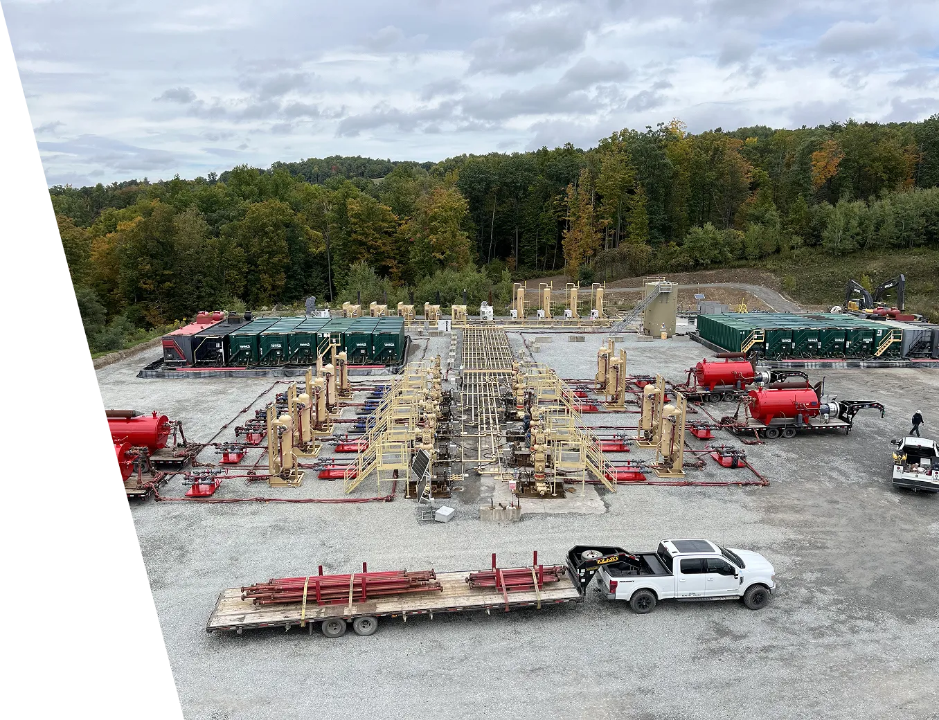 A group of trucks parked in a parking lot.
