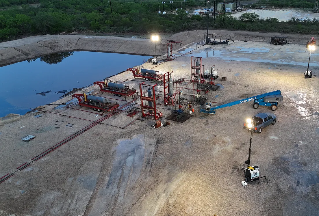 An aerial view of a construction site at night.