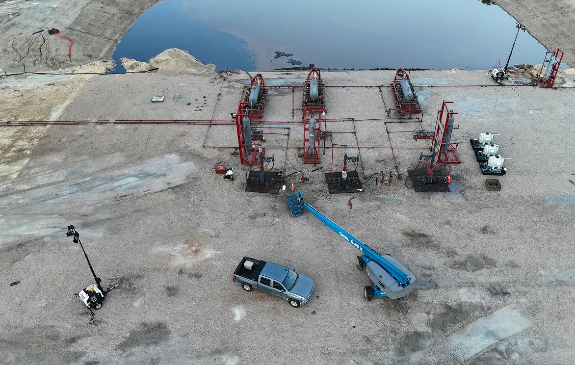An aerial view of a construction site near a body of water.