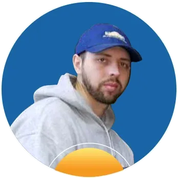 Young man wearing a blue baseball cap and a gray hoodie against a solid blue circular background.