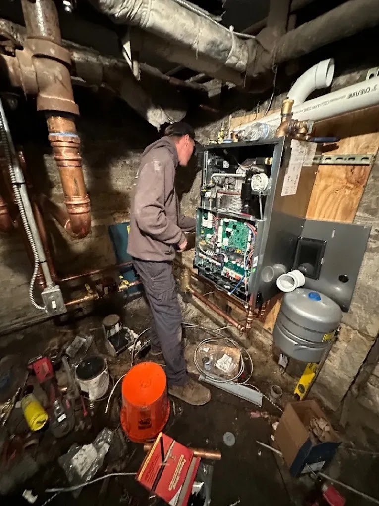 Homeowner consulting with technician about air conditioning replacement options