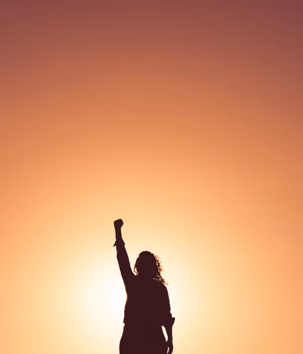 a woman with her fist in the air