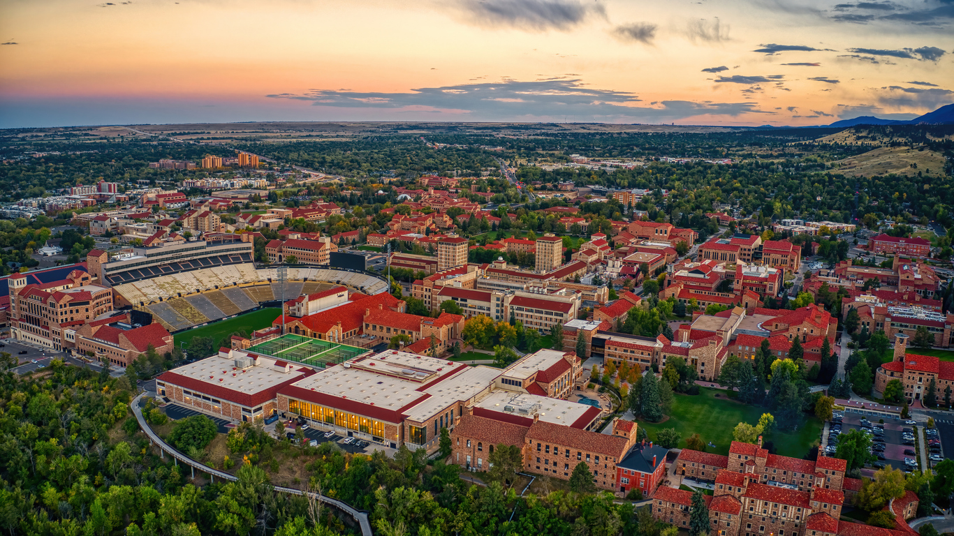 An aerial view of a city with a football stadium.