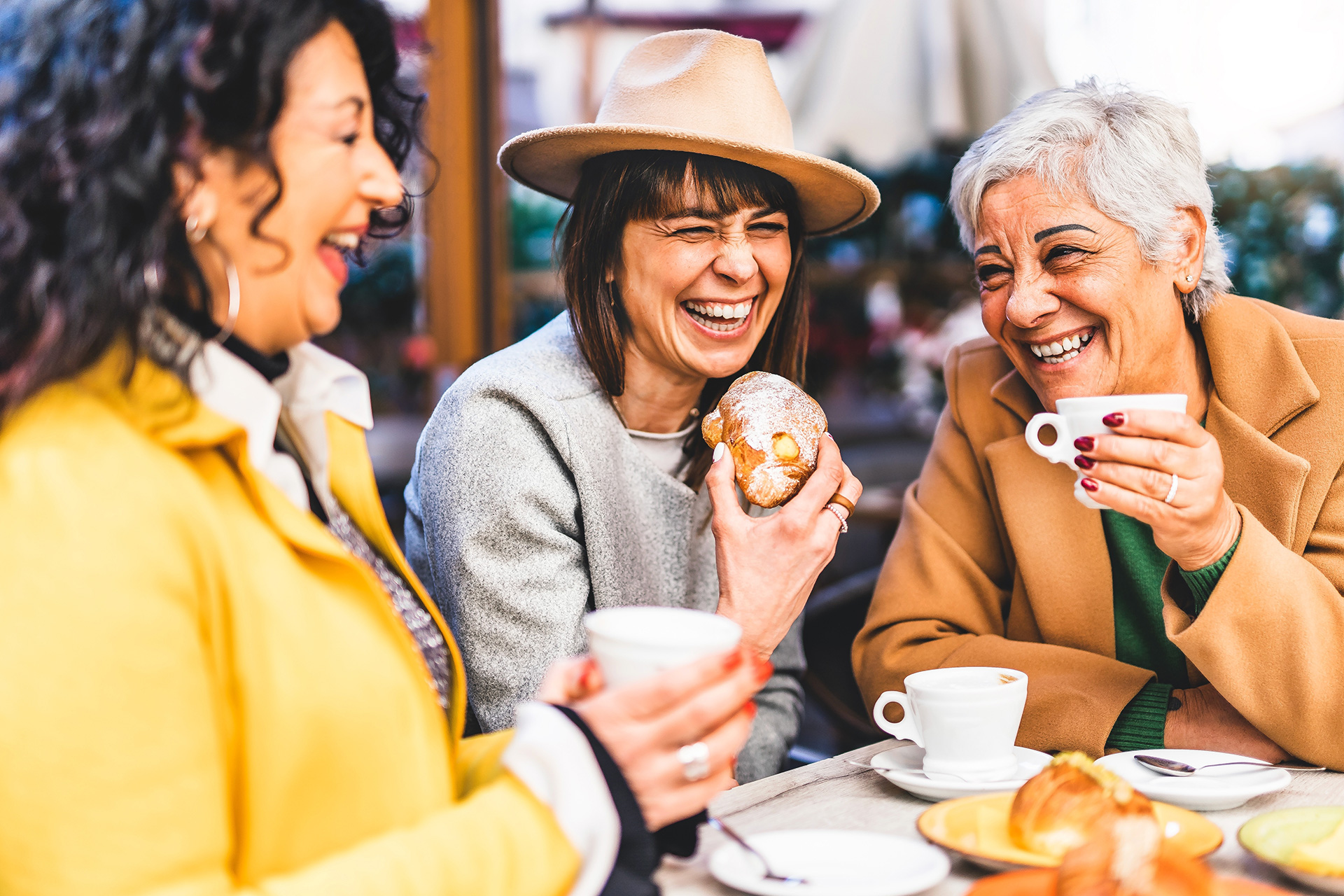 Three women drinking coffee