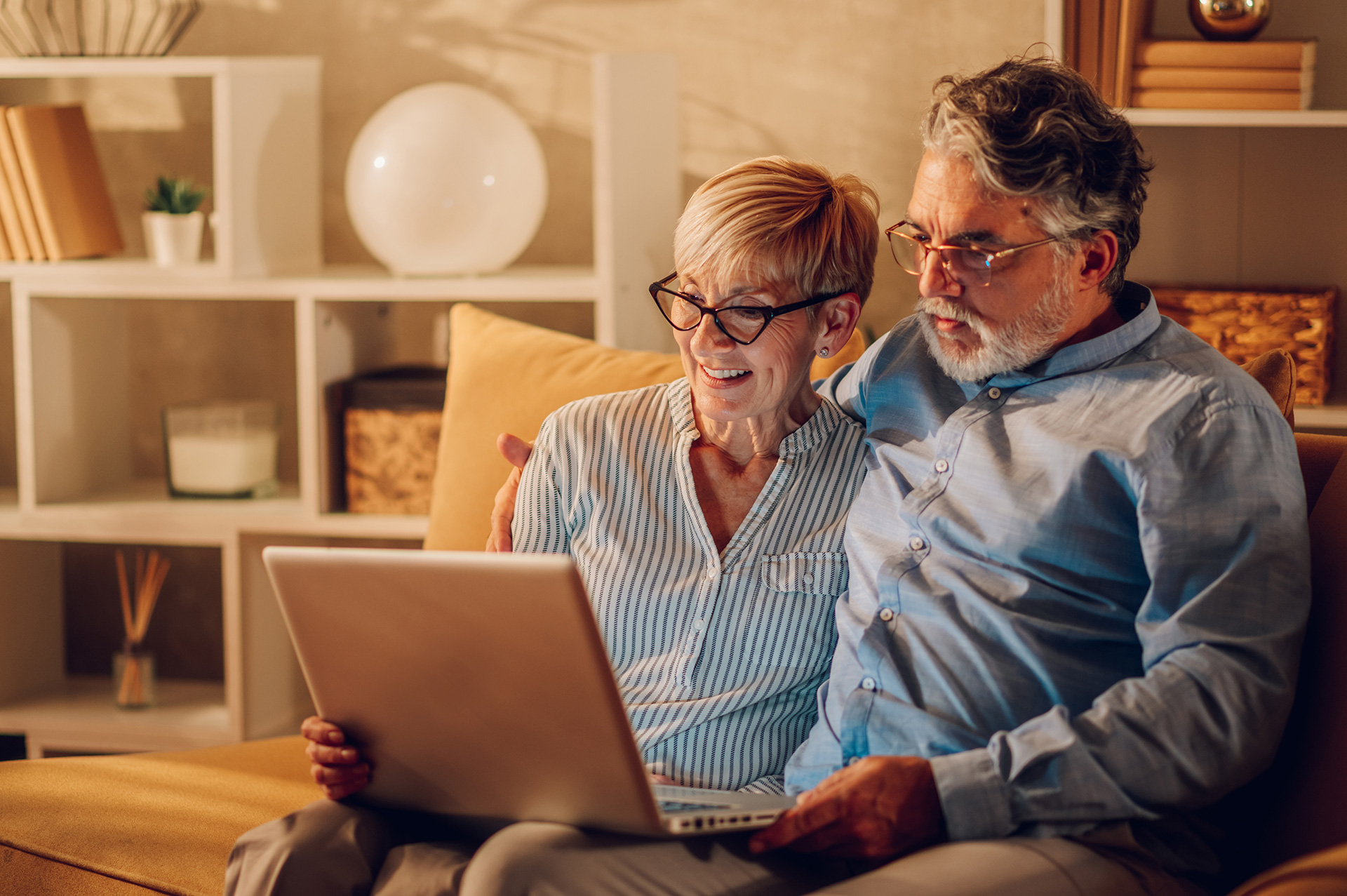 A man and a women looking at a computer screen