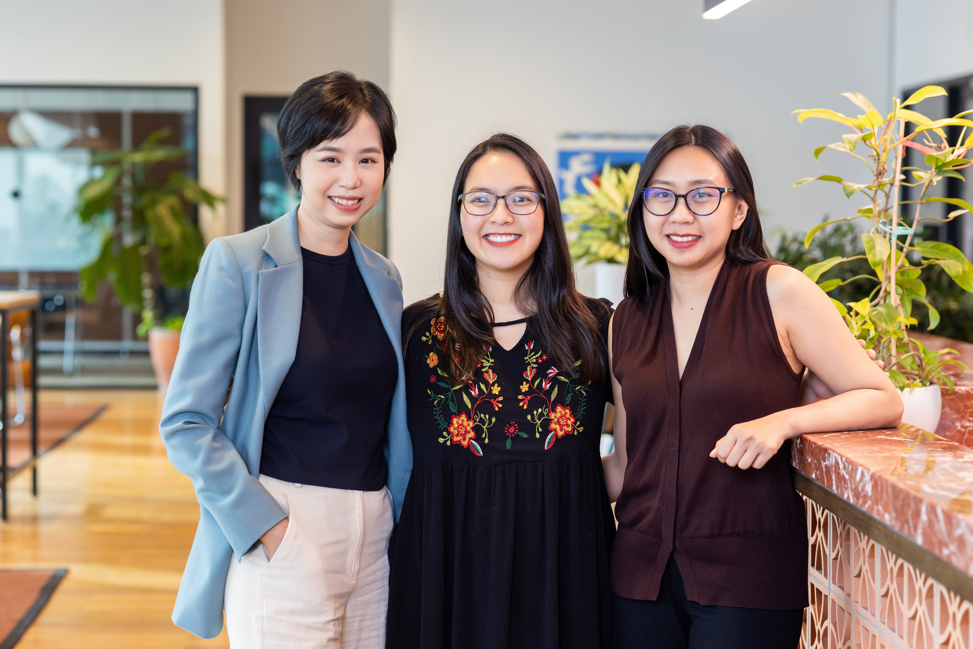 A portrait of three members of the AVV team.