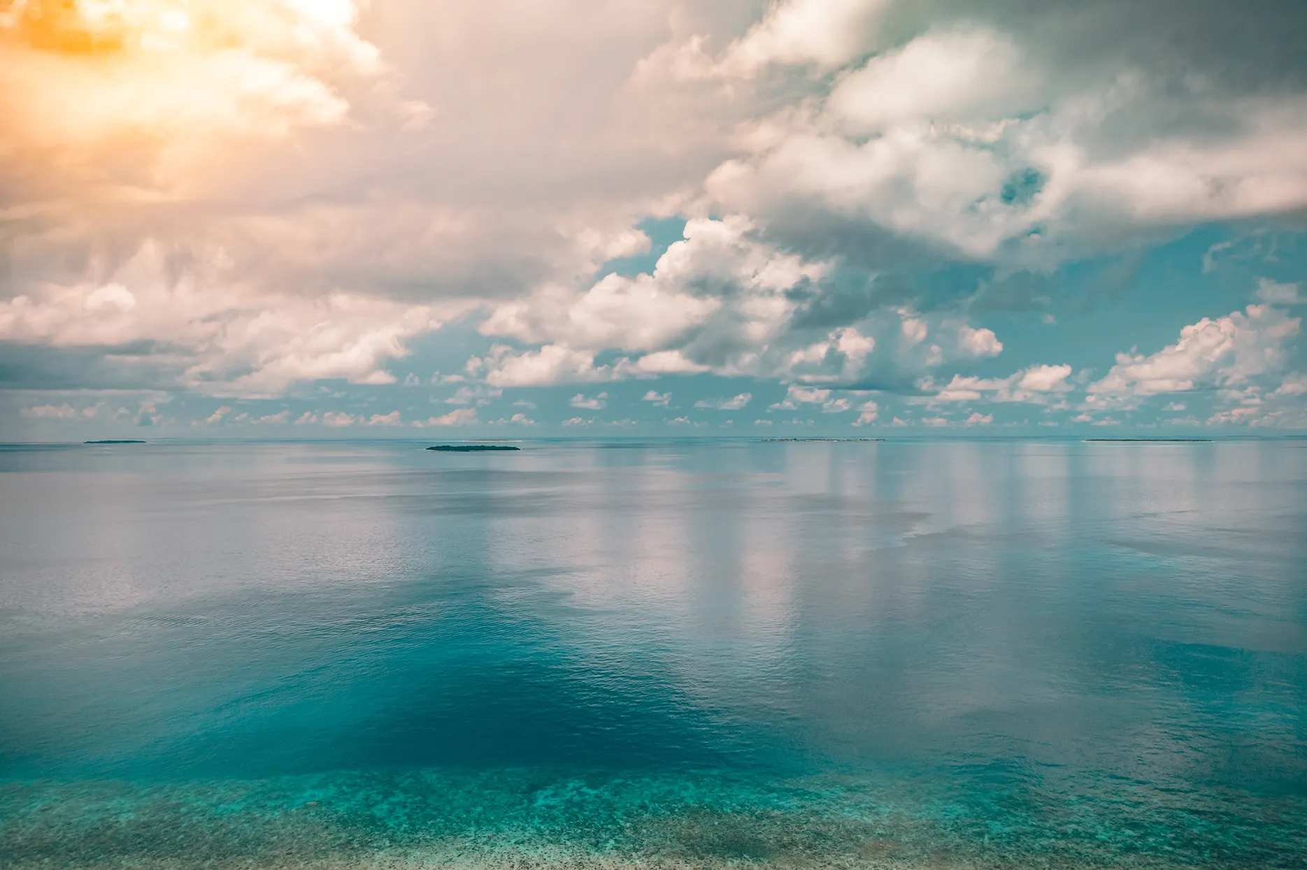 Calm Indian Ocean waters and islands, representing safari and beach journeys along the East African coast.