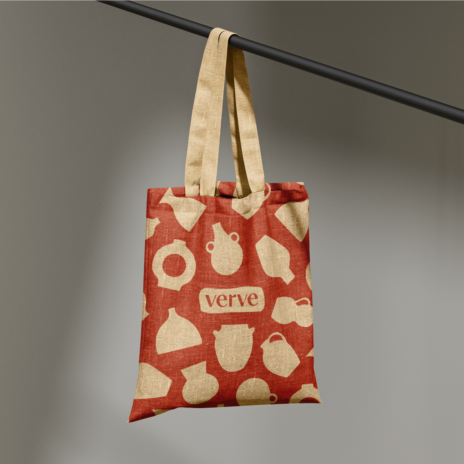 Verve pottery shop branded canvas tote bag featuring red background with cream ceramic silhouettes including vases, bowls, and teapots for artisan pottery store brand identity design