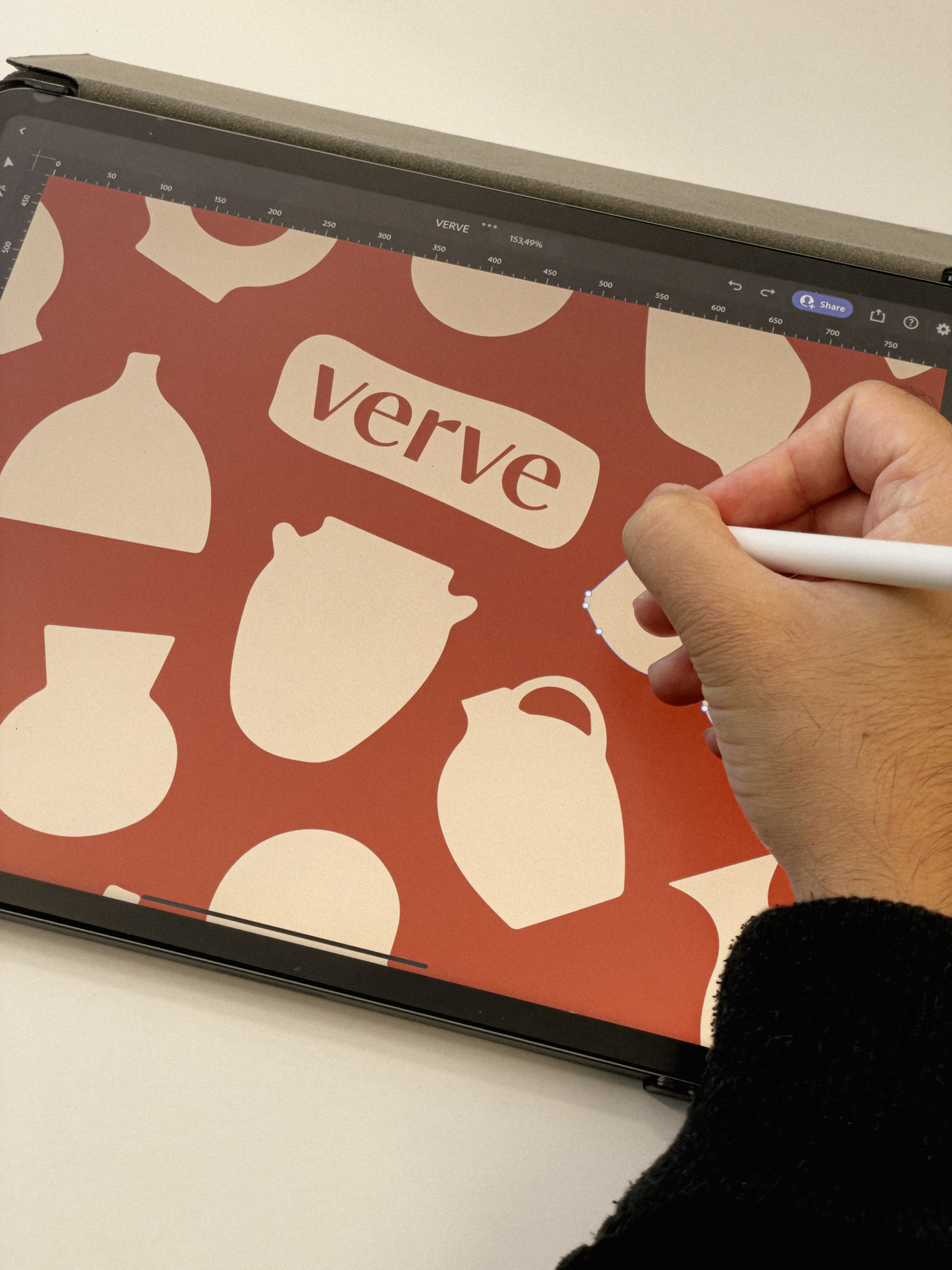 Verve pottery shop branded canvas tote bag featuring red background with cream ceramic silhouettes including vases, bowls, and teapots for artisan pottery store brand identity design