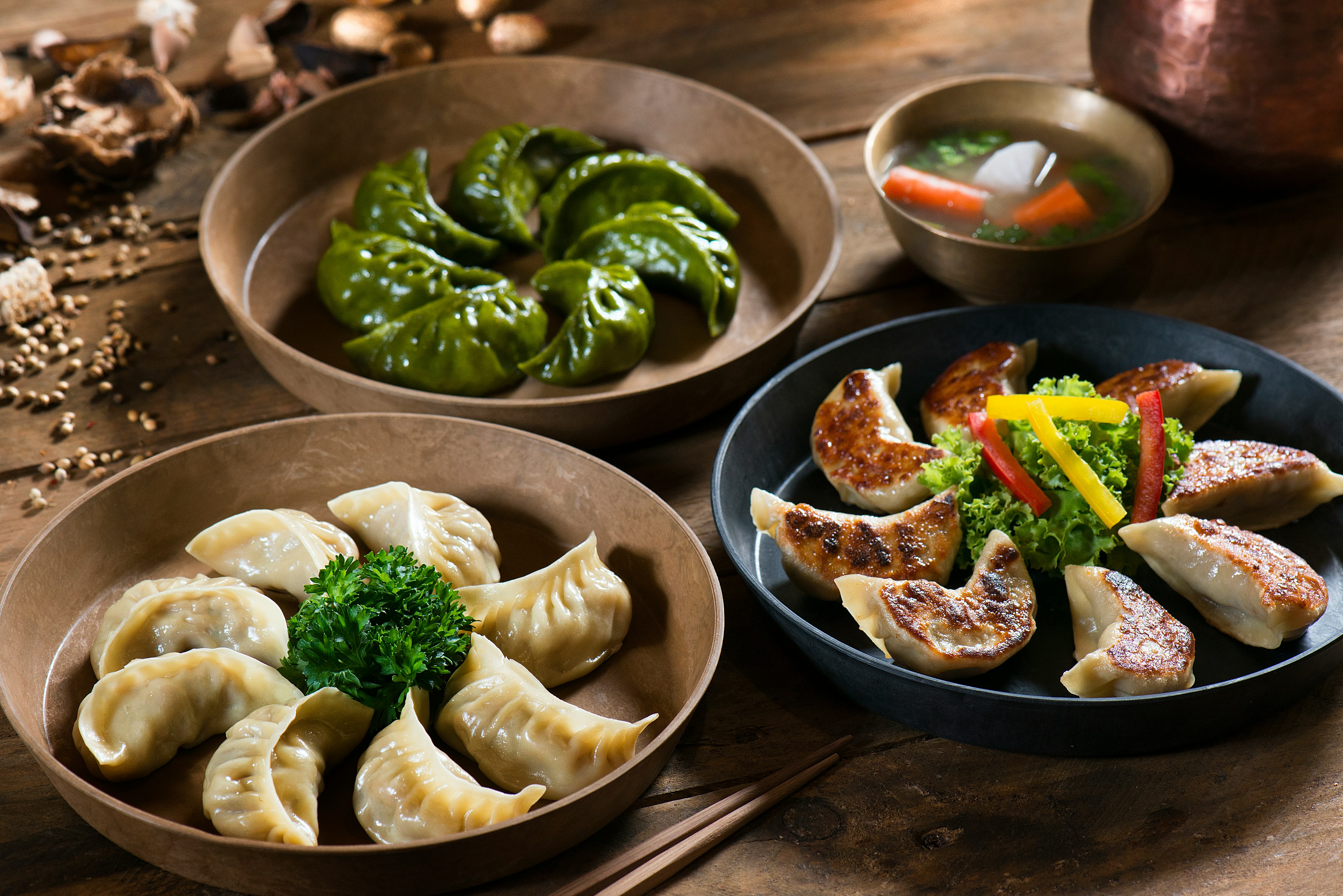 Steamed plant-based momos served with dipping sauce