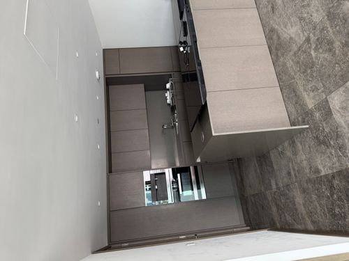 image of plumber fixing a sink