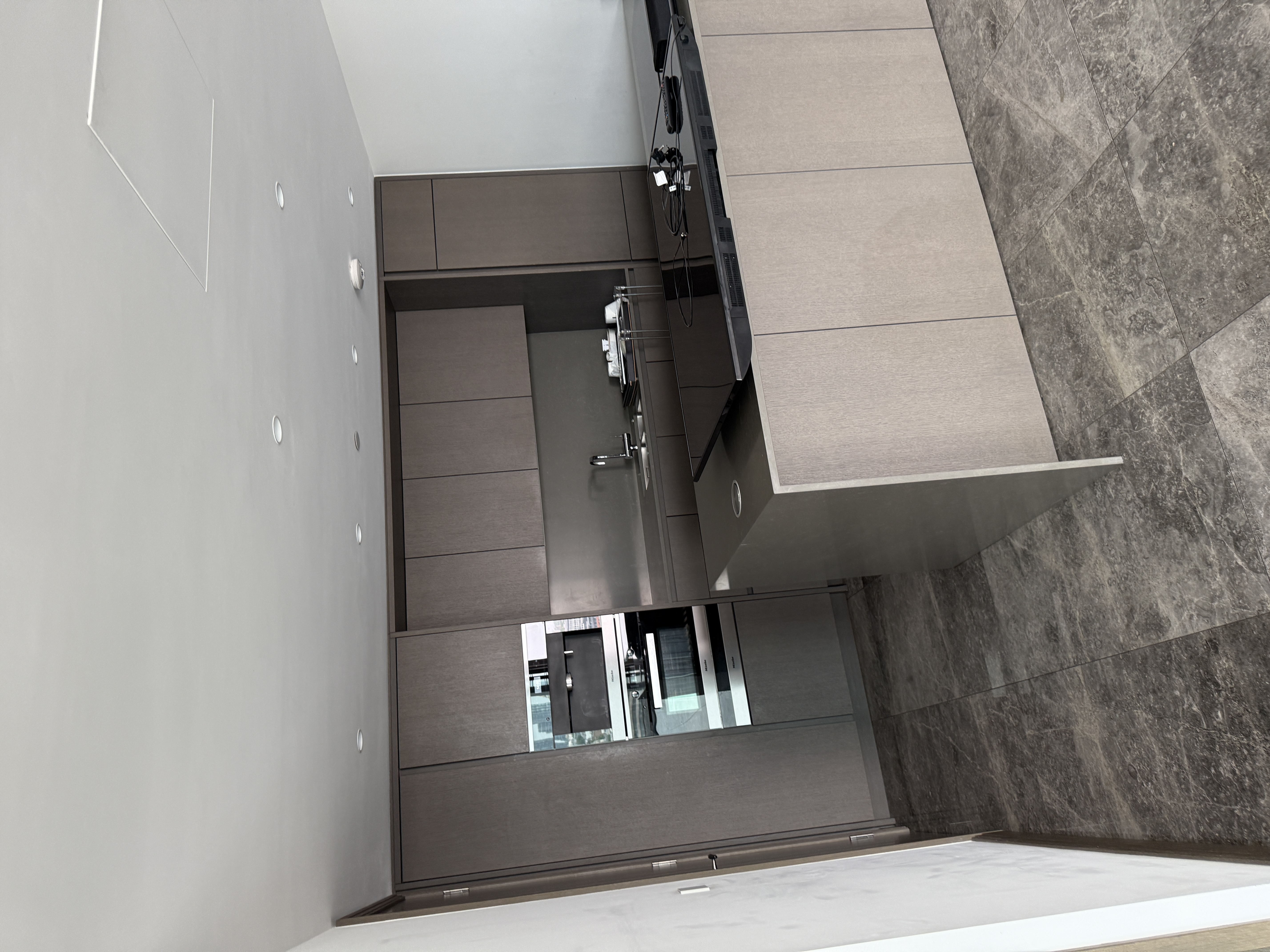 image of plumber fixing a sink