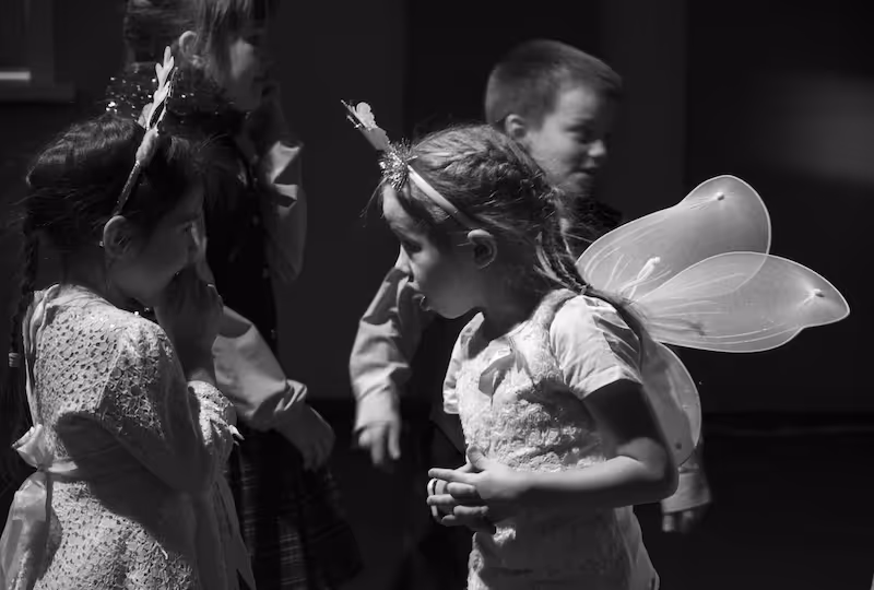 A black and white photo of a group of children.