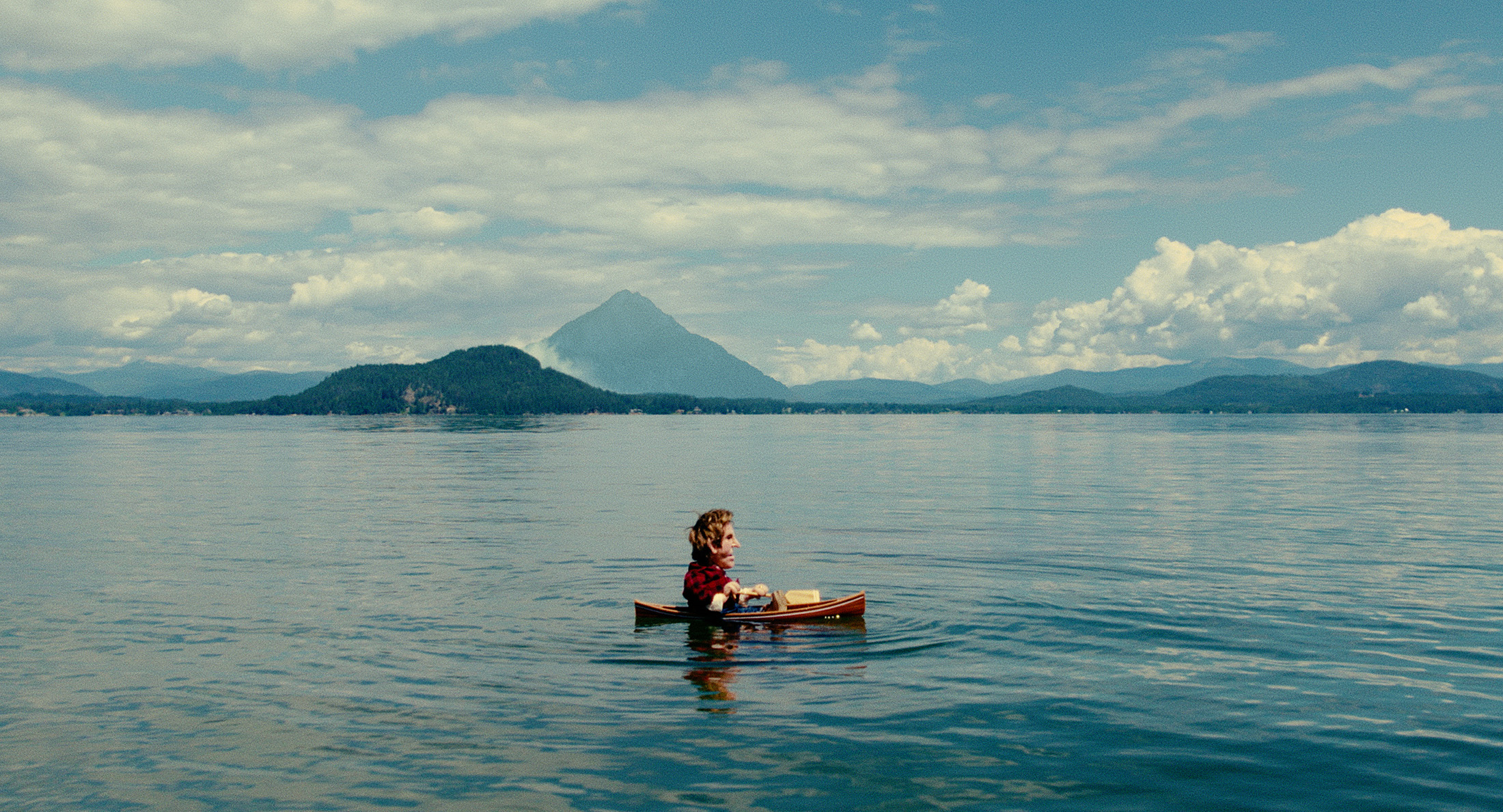 puppet in a boat on a lake