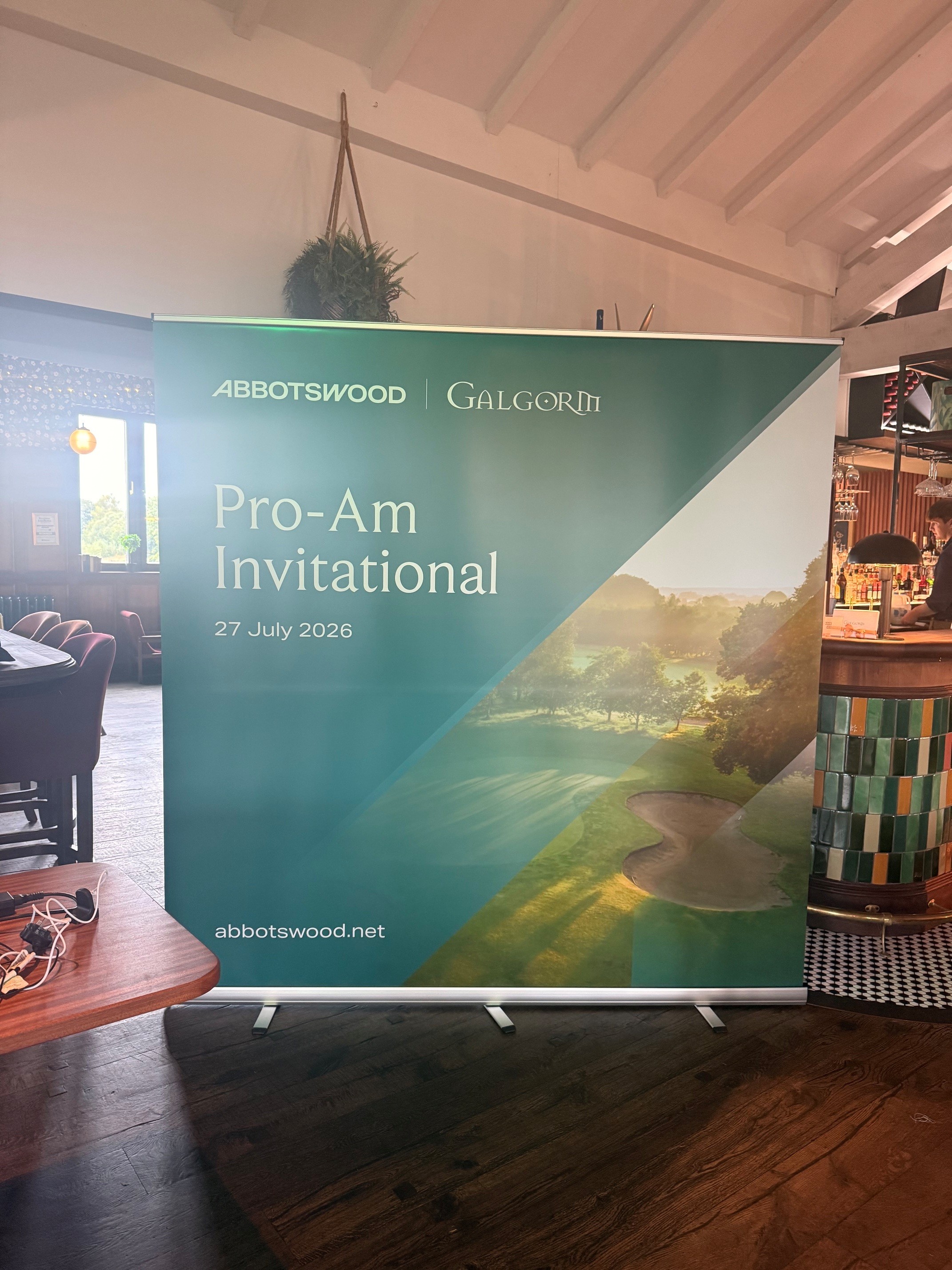 Banner for Abbotswood and Galgorm Pro-Am Invitational golf event on 27 July 2026 showing a golf course.