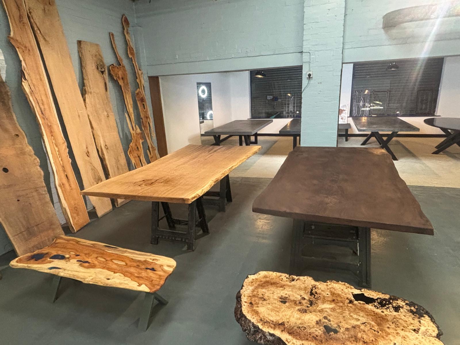 Variuous live edge tables ready to be delivered