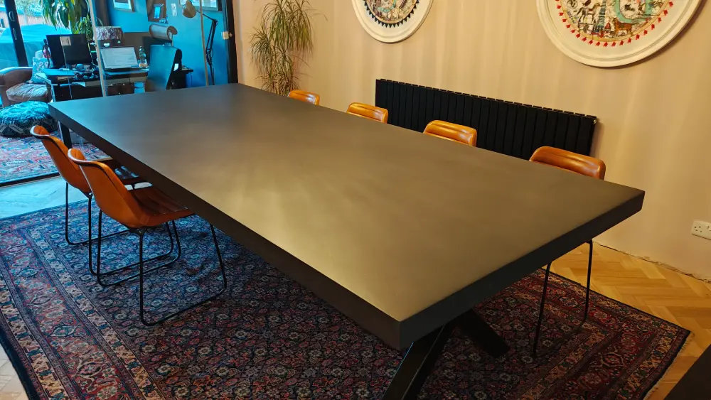 Bespoke polished concrete dining table in a modern interior
