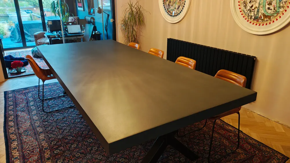 Architectural polished concrete table with strong linear form
