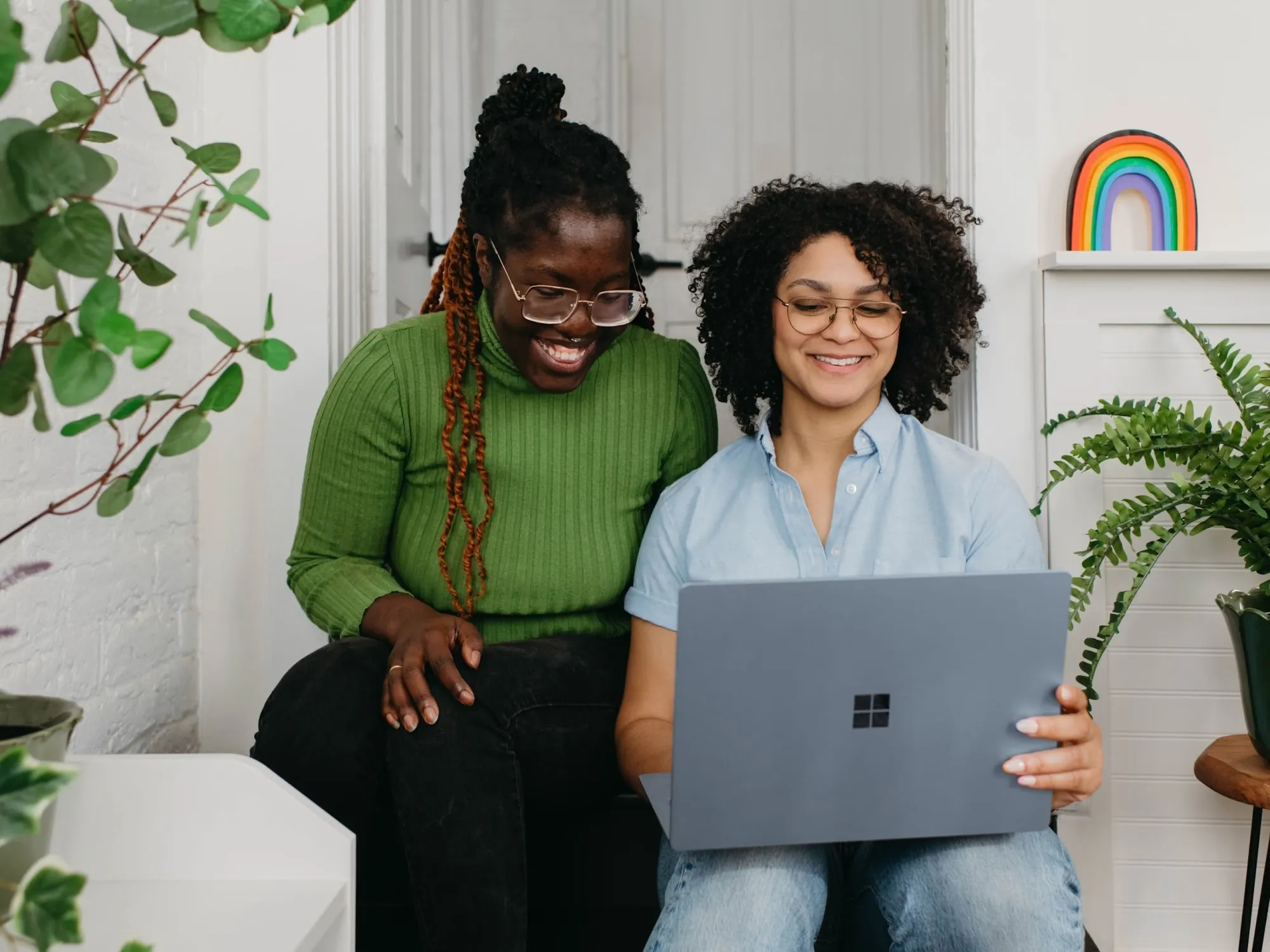 Women smiling at laptop
