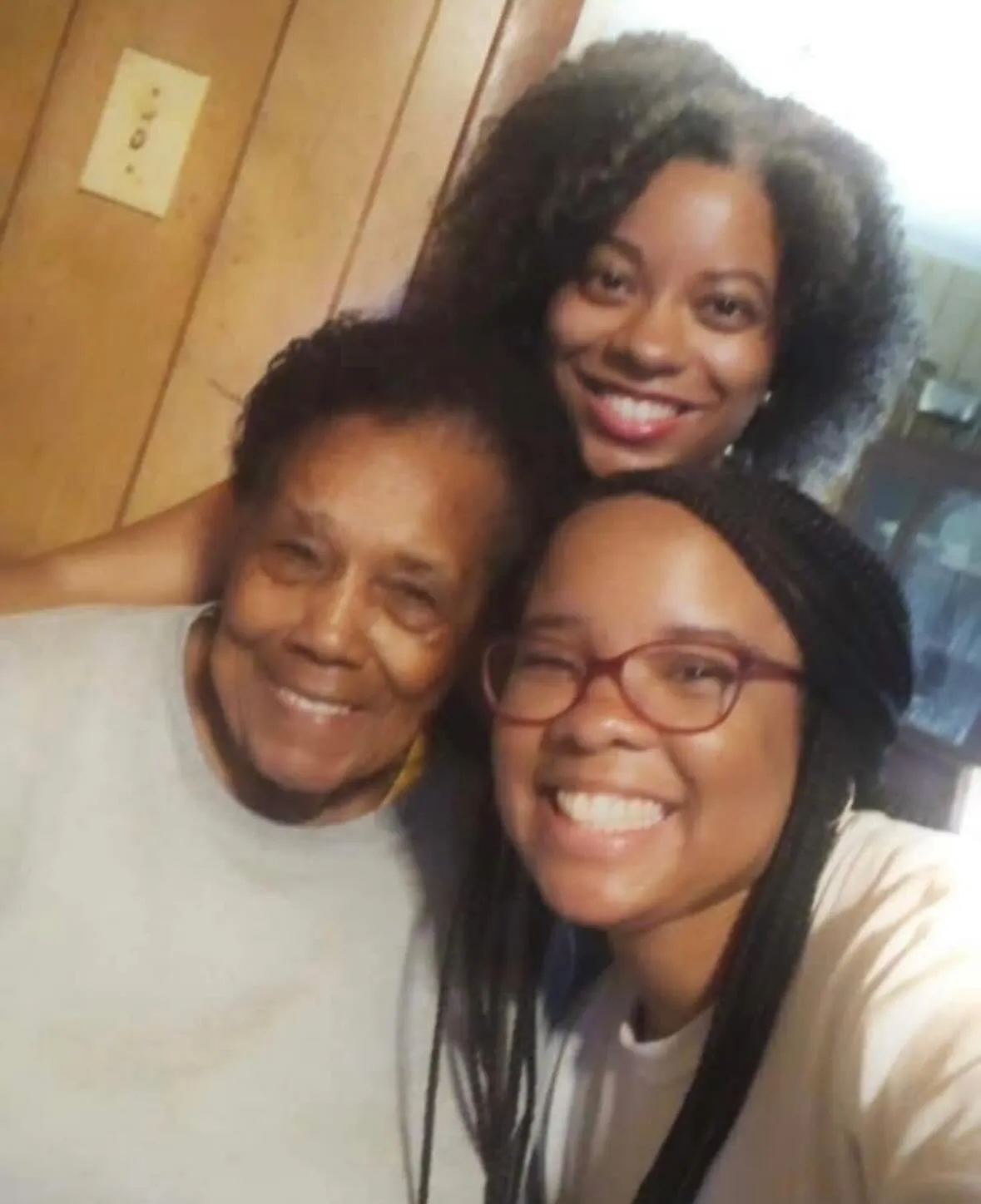 Three women posing for a picture.