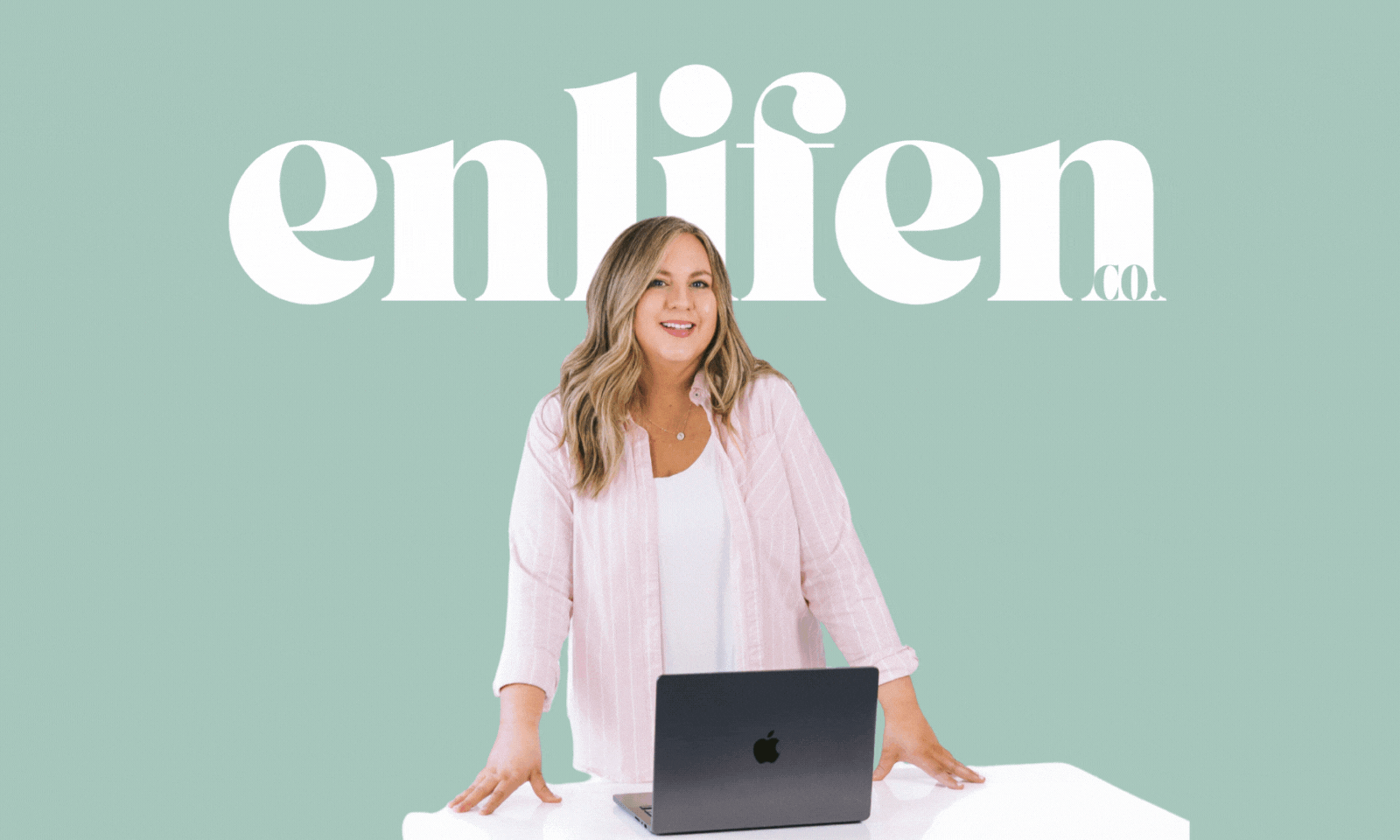 Jessica Chambers of Enlifen Co. holding a laptop, standing in front of the Enlifen logo on a teal background.