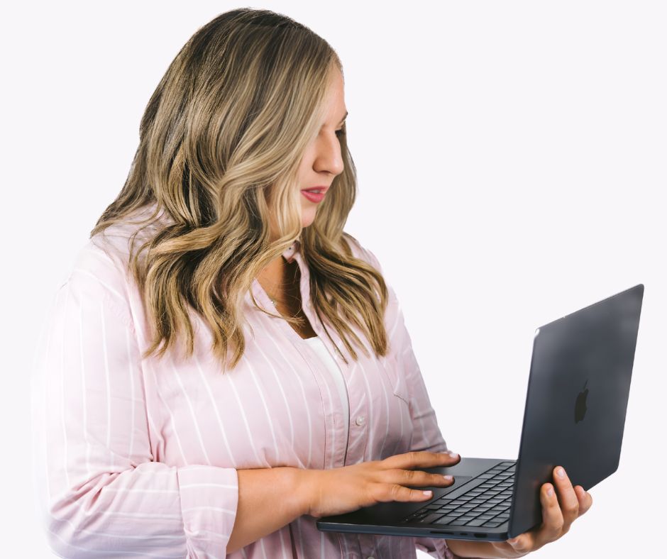 Jessica working on a laptop, looking at the screen while typing