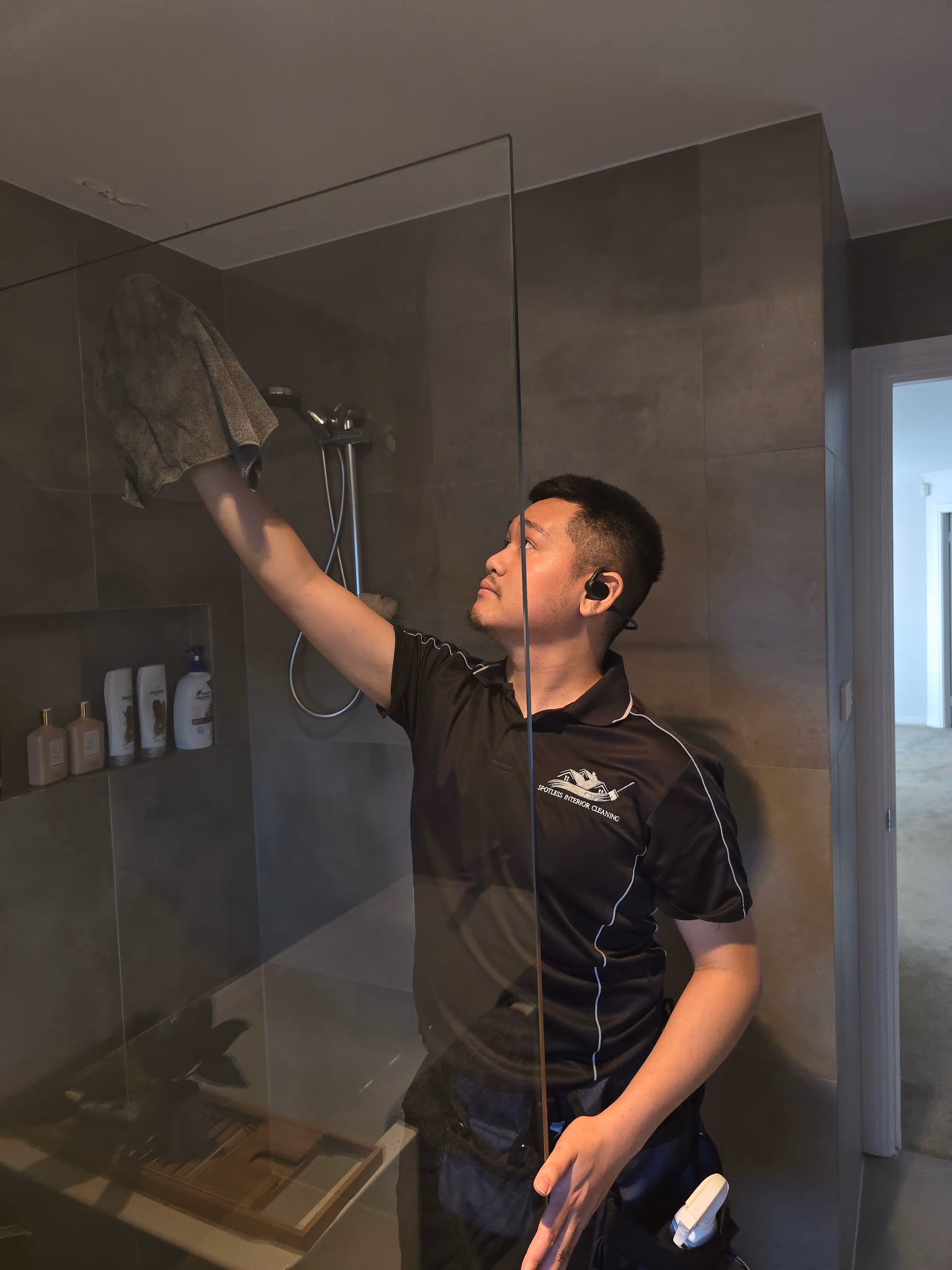 Professional house cleaner doing a deep clean of the bathroom – Spotless Interior Cleaning, Sydney. Westmead based