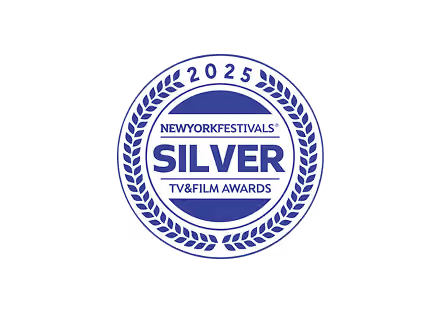Silver award emblem from the New York Festivals 2025 TV and Film Awards, featuring a circular laurel wreath design.