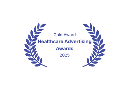 Gold Award Healthcare Advertising Awards 2025 text surrounded by two symmetrical laurel branches.