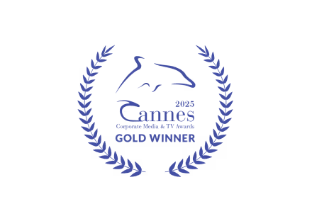 2023 Cannes Corporate Media & TV Awards Gold Winner emblem featuring a stylized dolphin surrounded by a laurel wreath.