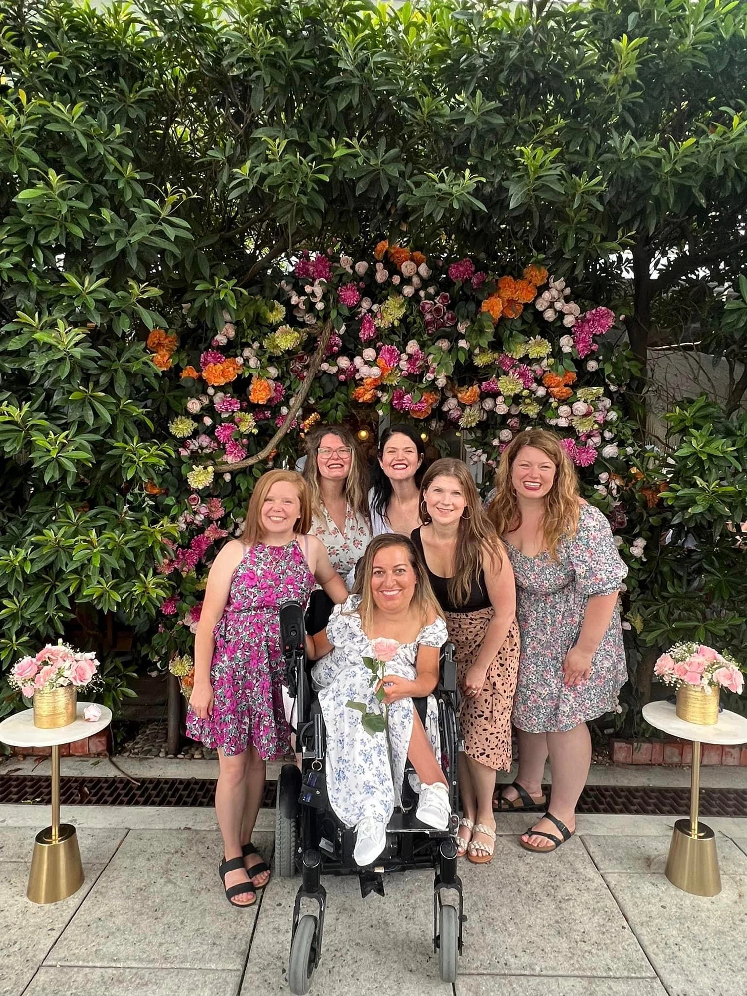 A group of women standing next to each other.