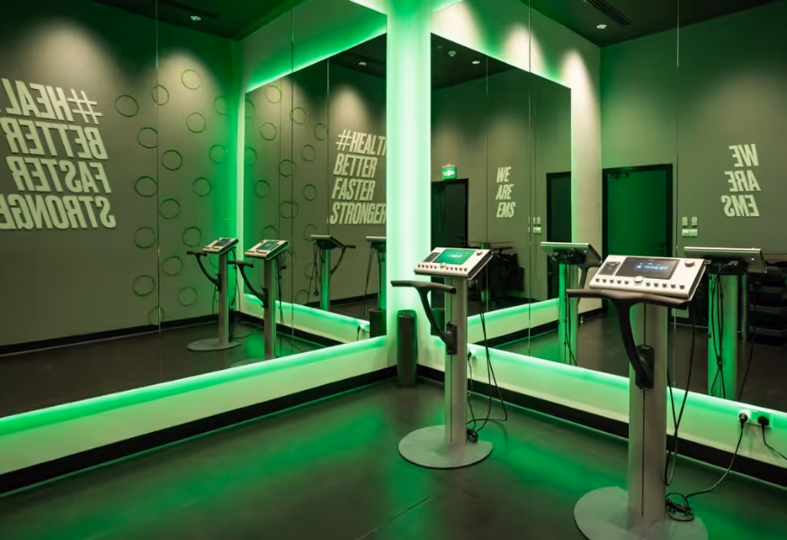 An indoor workout space featuring treadmills and mirrored walls