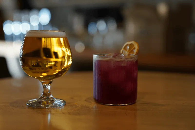 McLeod's Paradise Pale Ale and Pony Trail Cocktail with water vapor on edges, looking crisp