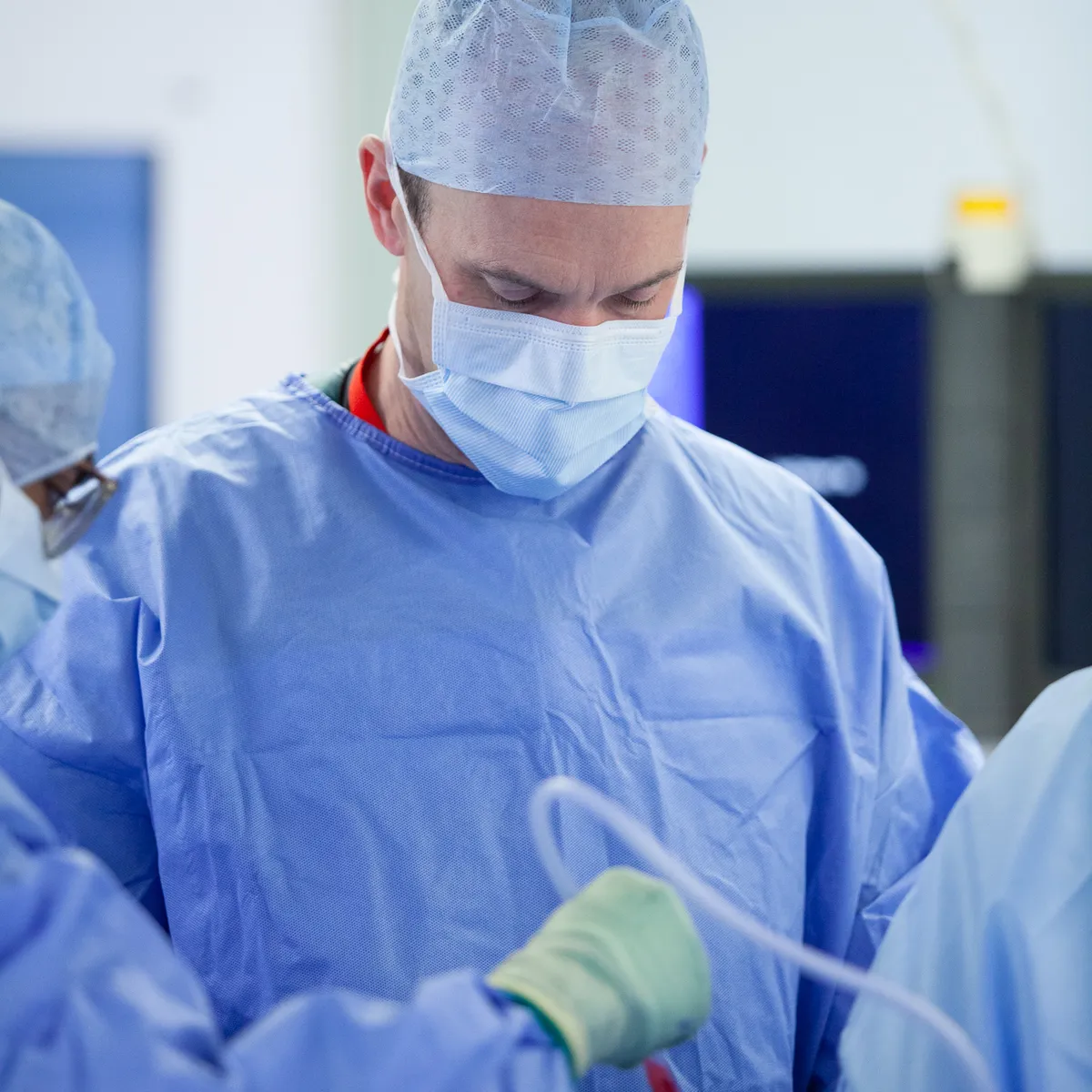 Mr Toby Baring operating in theatre