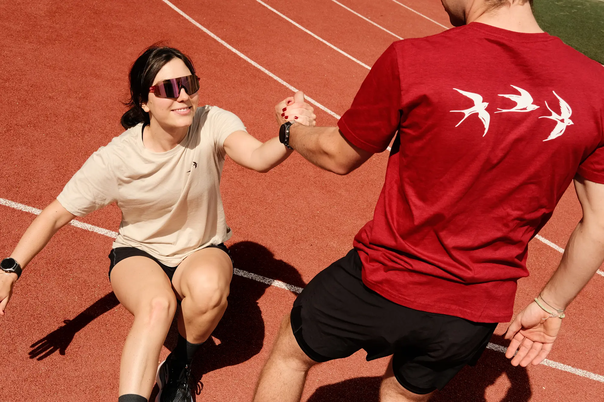Runners helping each other