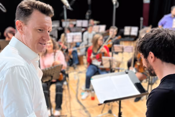 Conductor Davide Levi and Norman Reinhardt between takes