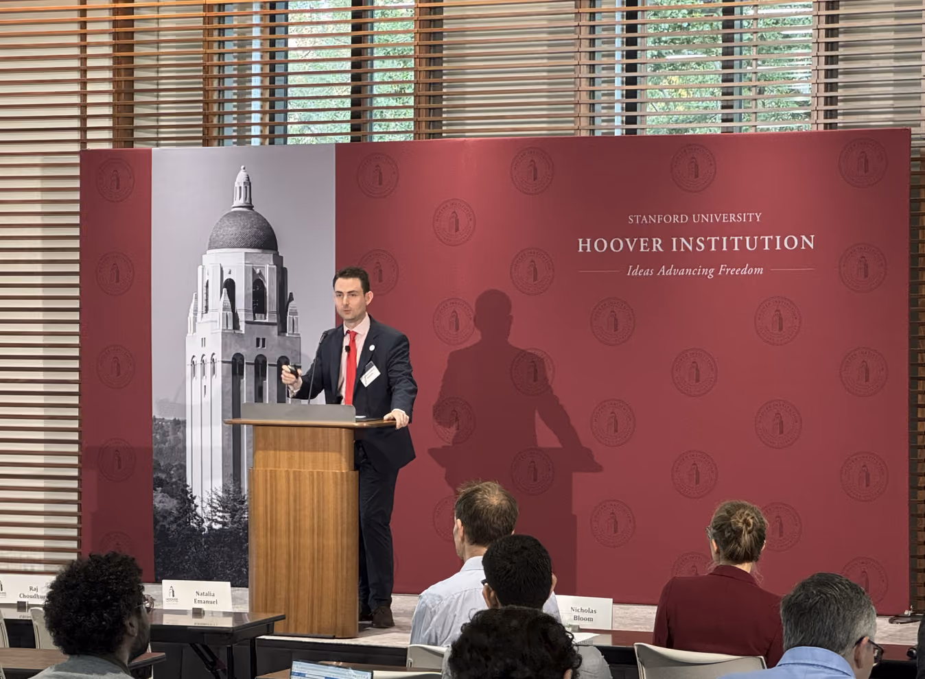 Dr. Christos Makridis presenting at Stanford University.