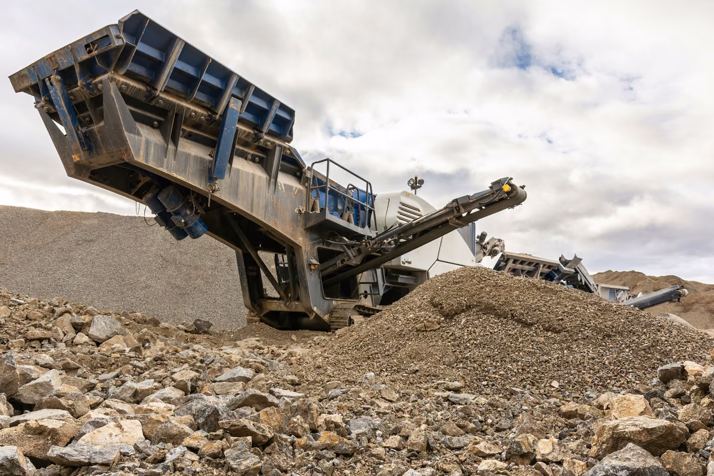 Mining machine sorting through rubble