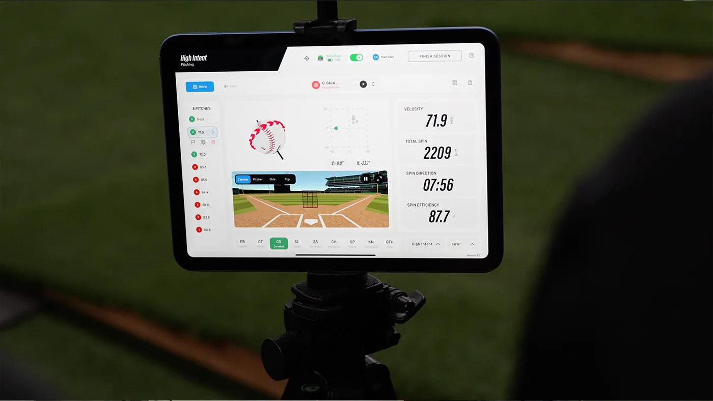 Tablet on a tripod showing verified pitching metrics like velocity and spin rate