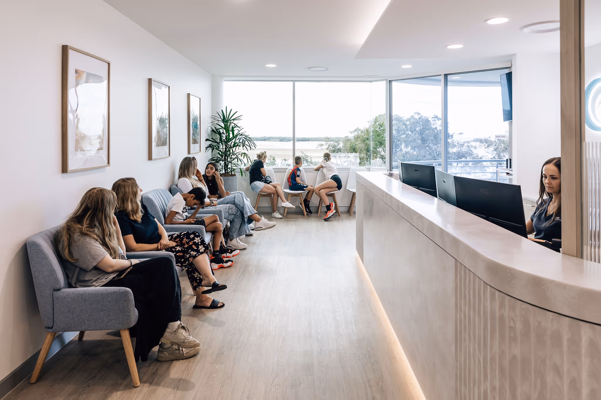 A group of people sitting in the waiting room at Ocean Orthodontics.