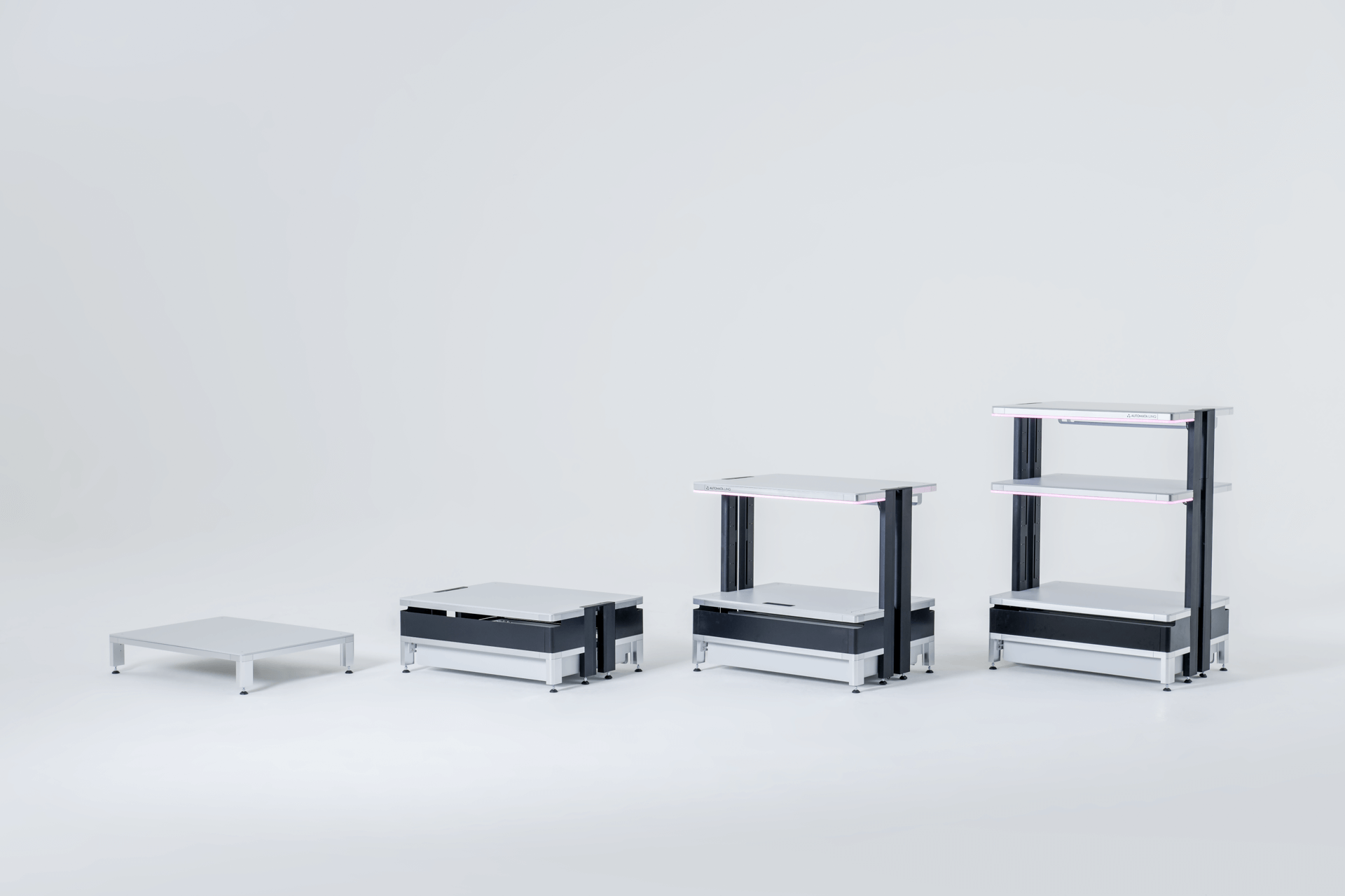 Four modular white and black adjustable-height platforms showing different raising stages from low to high.