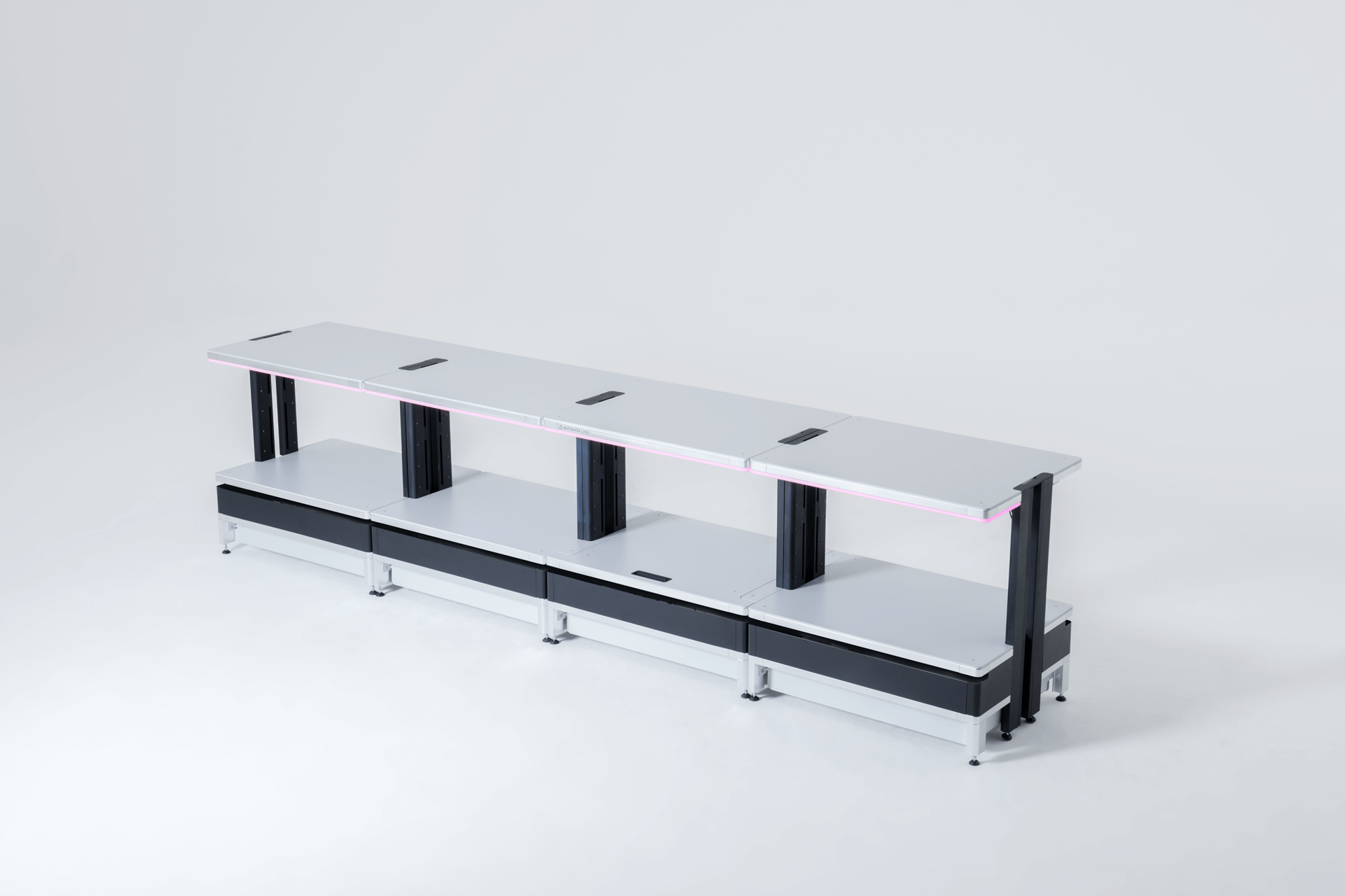 Modern minimalist long white workbench with black supports and integrated cable management ports on a white background.