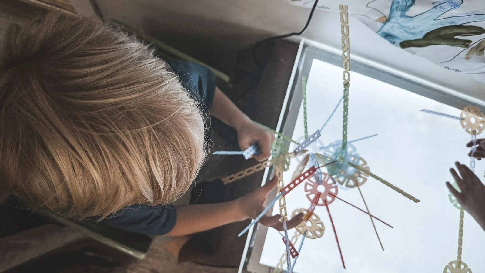 A young boy is working on a project.