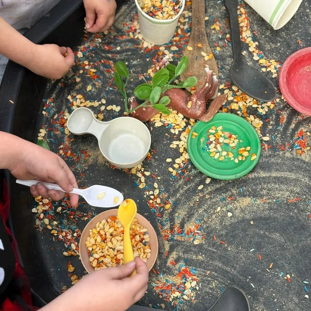 A group of people sitting around a table eating food.