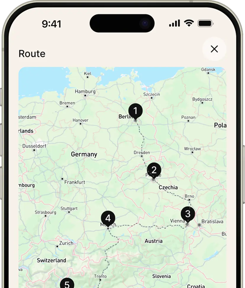 Smartphone screen showing a map with a travel route marked from Berlin through Prague, Vienna, Munich, and further south.