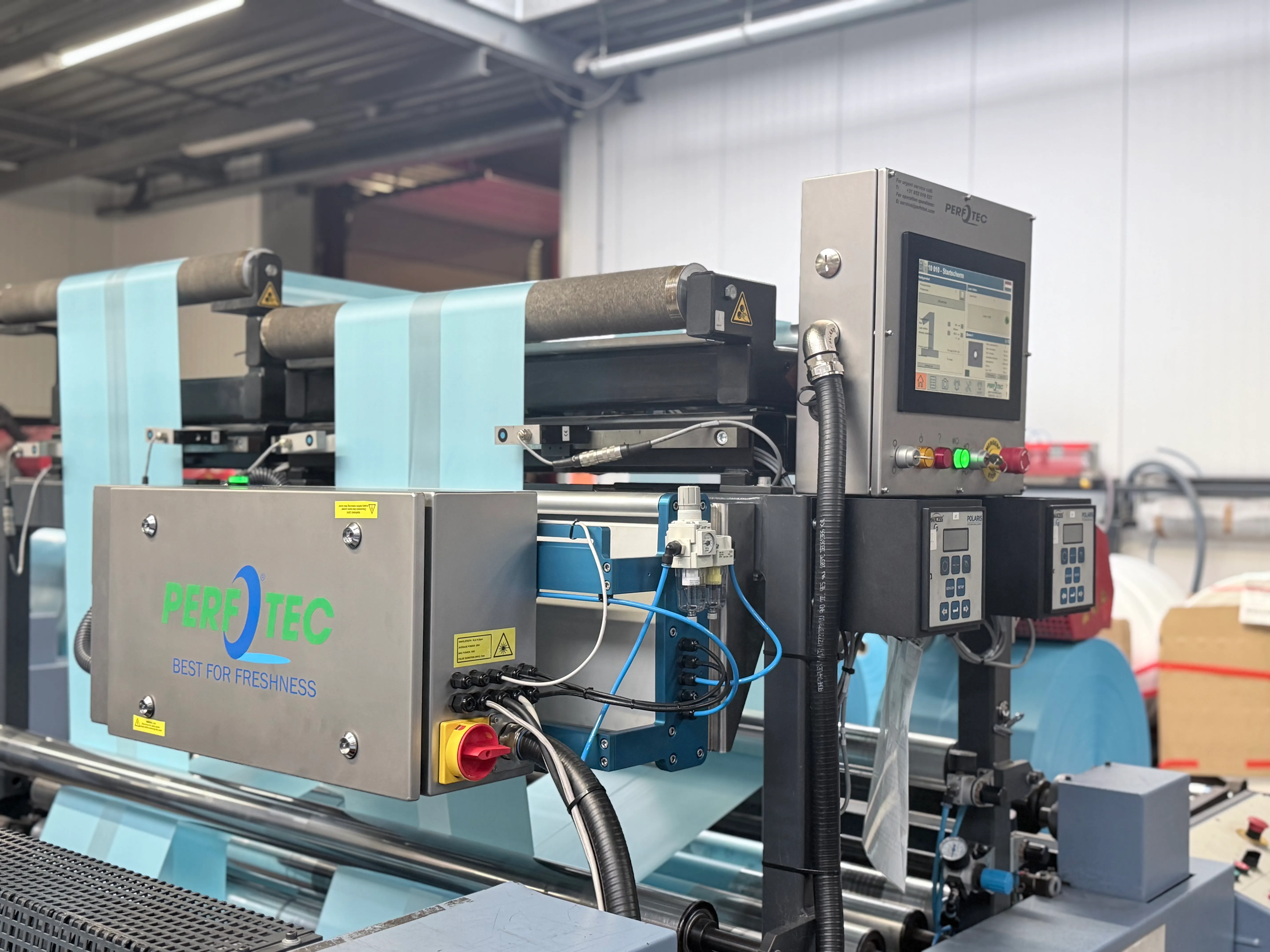 PerfoTec In-Line Laser installed on a packing line, with film running through the laser head