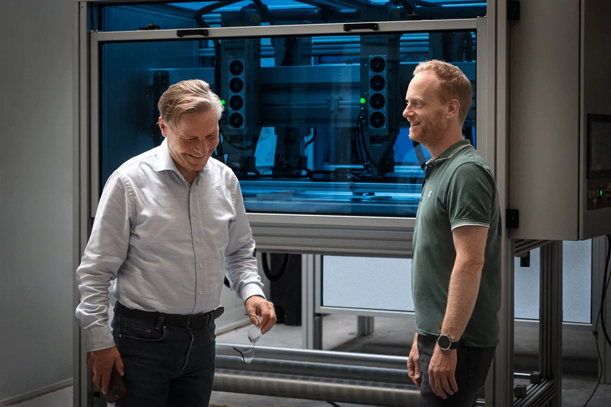 PerfoTec founder Bas Groeneweg and Martijn de Bruin in front of a PerfoTec laser system
